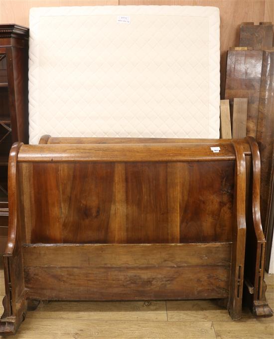 A French walnut and fruitwood sleigh bed, W.131cm